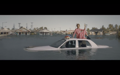 Beyonce on a car submerged in water